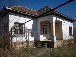 Small rural house with big yard located in a lively village