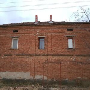 Old rural house with garage, barn and land in a big village