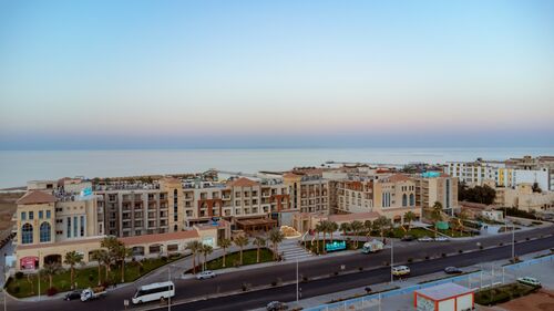 In front of SUNRISE Hotel